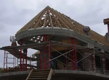 Contractors working on building a home