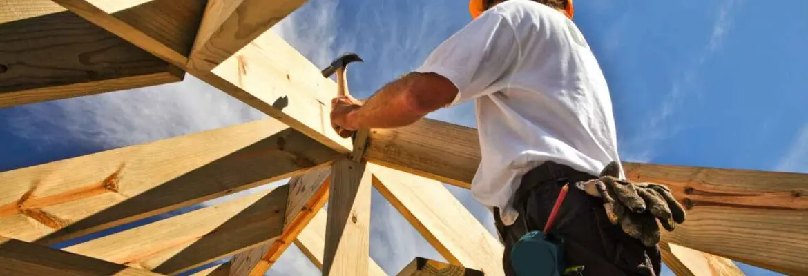 roofer ,carpenter working on roof structure at construction site