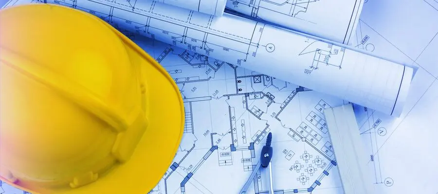 Pre-construction plan with a constrution hat