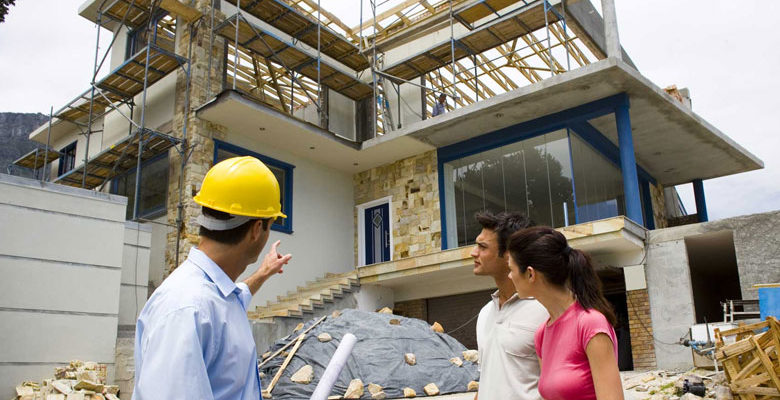 Contractor discussing with client the status of their home that is under construction
