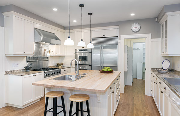 Luxury Kitchen Interior in white with wooden floor and kitchen i