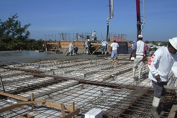 Contractors working on installing a roof