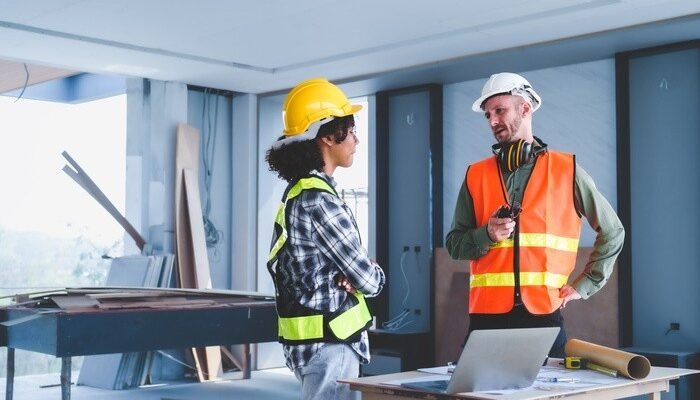 general contractor discuss remodeling and construction plan with engineer